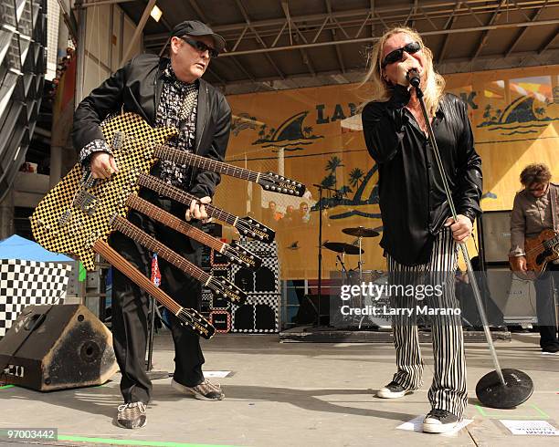 Rick Nielsen and Robin Zander of Cheap Trick perform on the tailgate stage at the Miami Dolphins game at Landshark Stadium on December 27, 2009 in...