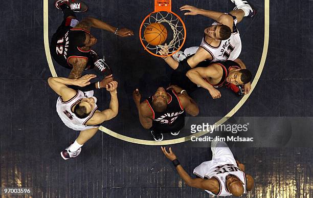 Brook Lopez, Yi Jianlian, and Trenton Hassell of the New Jersey Nets watch the ball against Lamarcus Aldridge, Dante Cunningham, and Brandon Roy of...