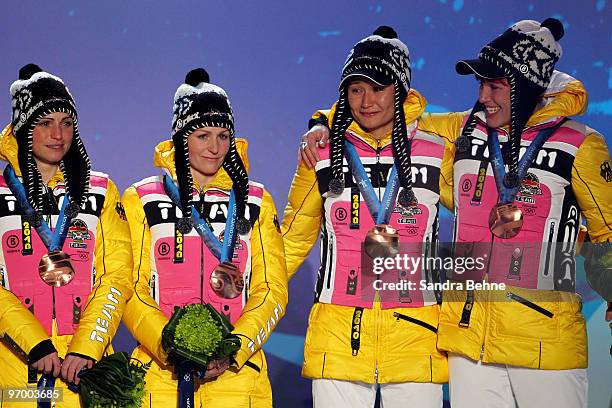 Team Germany celebrates winning the bronze during the medal ceremony for the in the women's biathlon 4 x 6km relay on day 12 of the Vancouver 2010...