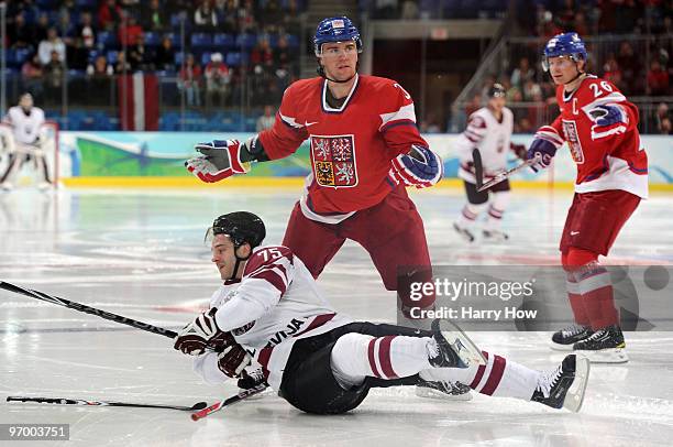 Marek Zidlicky of Czech Republic reacts after checking Girts Ankipans of Latvia during the ice hockey Men's Play-off qualification match between the...