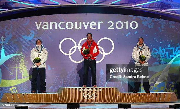 Silver medalist Kjetil Jansrud of Norway, gold medalist Carlo Janka of Switzerland and bronze medalist Aksel Lund Svindal of Norway pose after...