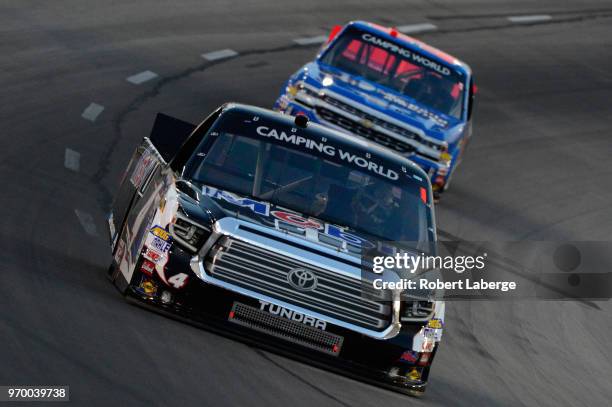 Todd Gilliland, driver of the Mobil 1 Toyota, leads Stewart Friesen, driver of the We Build America Chevrolet, during the NASCAR Camping World Truck...