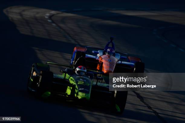 Charlie Kimball, driver of the Tresiba Chevrolet, leads Scott Dixon, driver of the PNC Bank Chip Ganassi Racing Honda, during practice for the...