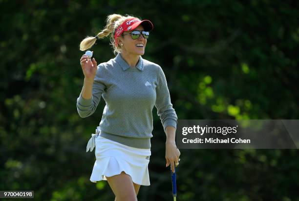 Natalie Gulbis acknowledges the gallery after making a birdie on the 17th green during the first round of the ShopRite LPGA Classic Presented by Acer...