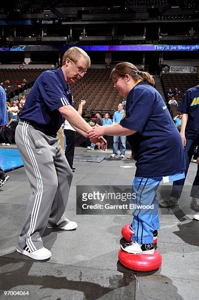 Trainer Jim Gillen of the Denver Nuggets work with an athlete from the Special Olympics of Colorado on February 23, 2010 at the Pepsi Center in...