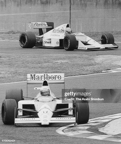 Alain Prost of France and McLaren-Honda leads to Ayrton Senna of Brazil and McLaren-Honda in the race of the Formula One Japanese Grand Prix at...