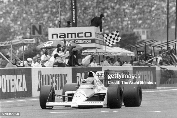 Ayrton Senna of Brazil and McLaren-Honda finishes first before disqualified in the race of the Formula One Japanese Grand Prix at Suzuka Circuit on...