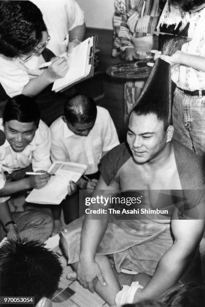 Yokozuna Chiyonofuji speaks to media reporters after his 964 career win, ties to Oshio, on day twelve of the Grand Sumo Autumn Tournament at Ryogoku...