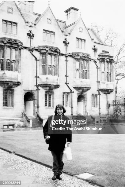 Masako Owada poses for photographs in front of Merton College circa November 1989 in Oxford, England.