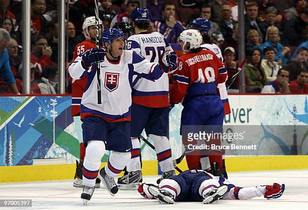 Lubomir Visnovsky of Slovakia reacts towards the bench as teammate Lubos Bartecko lies motionless on the ice in the first period during the ice...
