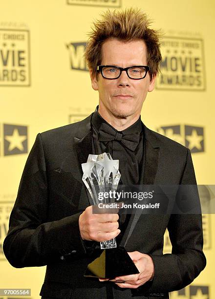 Actor Kevin Bacon poses with the Joel Siegel award in the press room at the 15th Annual Critic's Choice Movie Awards at the Hollywood Palladium on...