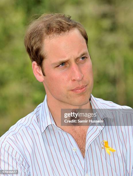 Prince William speaks to members of a family who lost their home to the bushfires of 2009 on the third and final day of his unofficial visit to...