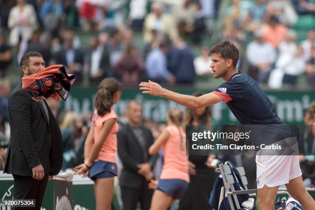 June 5. French Open Tennis Tournament - Day Ten. Dominic Thiem of Austria passes his towel to a spectator after his win against Alexander Zverev of...