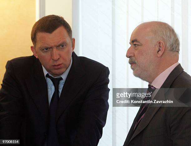 Russian businessman Oleg Deripaska and finance minister Viktor Vekselberg talk as they visit Sayano-Shushenslkaya Hydroelectic Power Plant, which was...