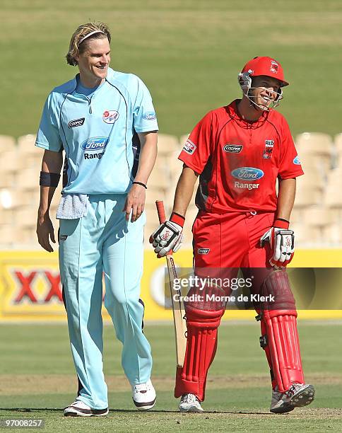 Captain Graham Manou of the Redbacks shares a joke with Nathan Bracken of the Blues during the Ford Ranger Cup match between the South Australian...