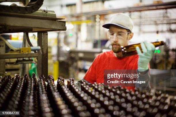 worker working at beer manufacturing industry - beer goggles stock pictures, royalty-free photos & images