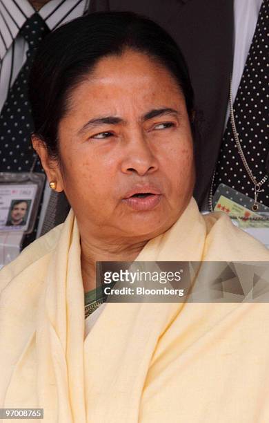 Mamata Banerjee, India's railway minister, leaves the railways ministry on her way to the Indian Parliament to present the railways budget for the...