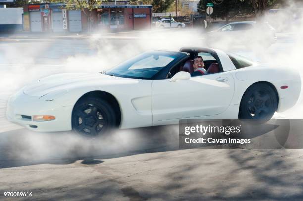 mechanic drifting car on road - schneewehe stock-fotos und bilder