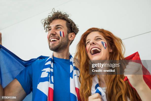 soccer fans cheering for national teams at the game - france supporter stock pictures, royalty-free photos & images