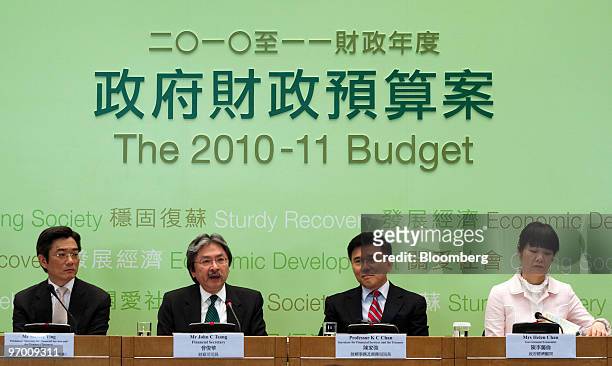 John Tsang, Hong Kong's financial secretary, second from left, attends a news conference at the Government Offices in Hong Kong, China, on Tuesday,...