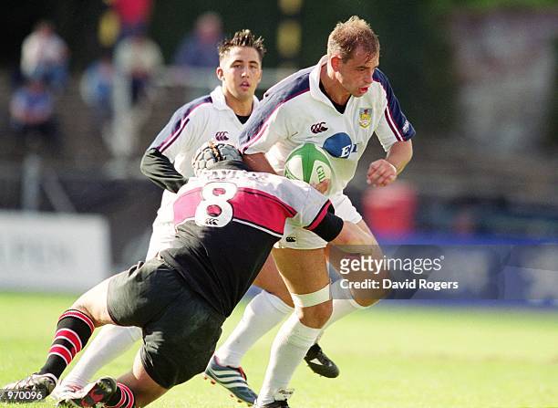 Hywel Jenkins of Swansea is tackled by Simon Taylor of Edinburgh during the 2001/02 Heineken Cup match between Swansea and Edinburgh played at St....