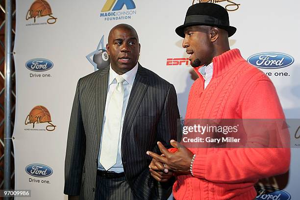 Former NBA players Earvin "Magic" Johnson and Alonzo Mourning arrive at "Zo and Magic's 8-Ball Challenge" at Centennial Hall at Fair Park on February...