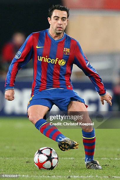 Xavi Hérnandez of Barcelona runs with the ball during the UEFA Champions League round of sixteen, first leg match between VfB Stuttgart and FC...