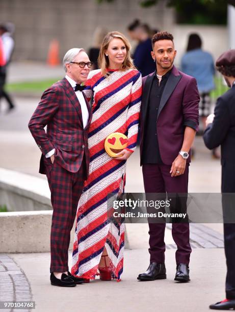 Tommy Hilfiger, Dee Ocleppo and Lewis Hamilton arrive to the 2018 CFDA Fashion Awards at Brooklyn Museum on June 4, 2018 in New York City.