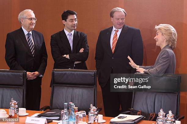 German Economy Minister Rainer Bruederle , Development Minister Dirk Niebel and Health Minister Philipp Roesler chat with Minister of Work and Social...