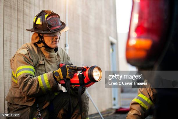Fireman Tea Light Fireman Flashlight Photos and Premium High Res Pictures - Getty Images