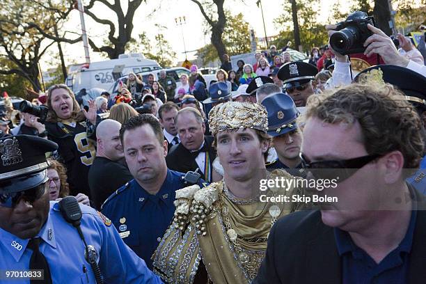 New Orleans Saints Quarterback and Super Bowl MVP Drew Brees reigns as King of Bacchus as he is escorted to the King's float in the 2010 Krewe Of...