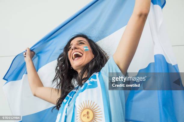 soccer fan cheering for national team at the game - argentina national soccer team stock pictures, royalty-free photos & images