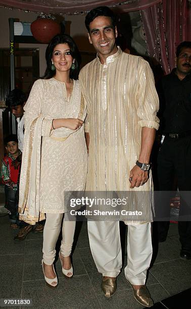 Bollywood actor Akshay Kumar and his wife, actress Twinkle Khanna, arrive to attend the wedding reception for Rashi Agarwal and Hemant Bhanadari at...