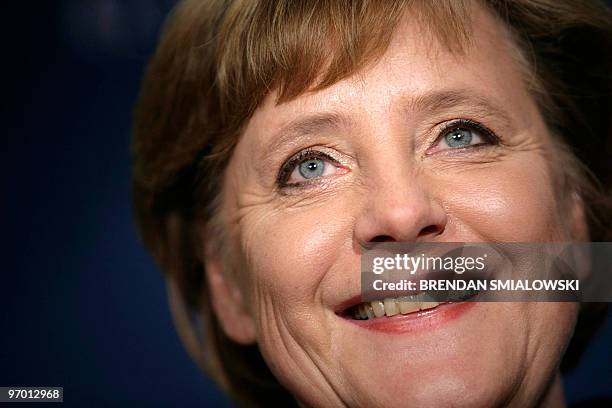 Portrait taken on January 13, 2006 shows German Chancellor Angela Merkel smiling during a dedication ceremony for the new German Marshall Fund...
