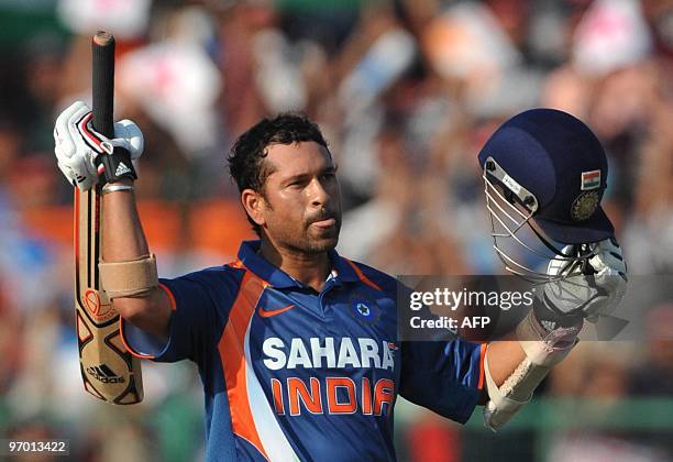 Sachin Tendulkar of India celebrates his 100 during the 2nd ODI between India and South Africa at Captain Roop Singh Stadium on February 24, 2010 in...