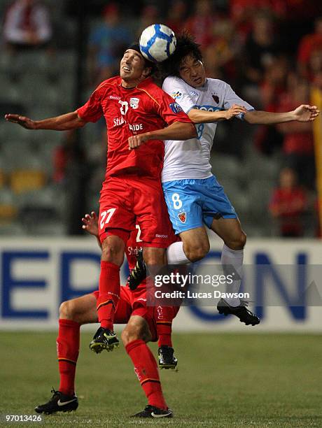 Adam Griffiths of Adelaide United and Kim Hyungil of the Pohang Steelers contest the ball during the AFC Champions League match between Adelaide...