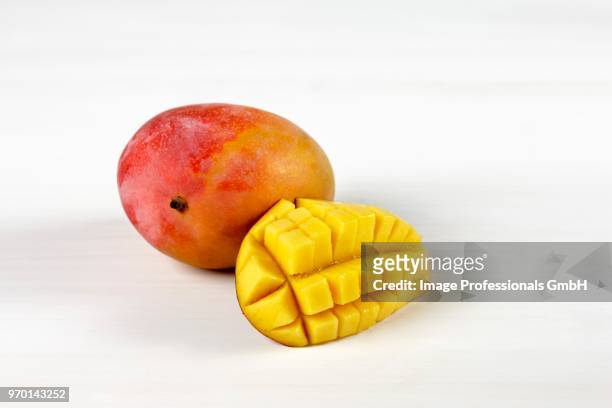 mangoes on a white background - mango stock pictures, royalty-free photos & images