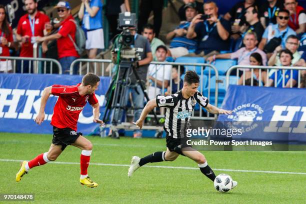 Victor Fernandez of Newcastle United fights for the ball with Liam Burt of Glasgow Rangers during the Main Cup Final match between Newcastle United...