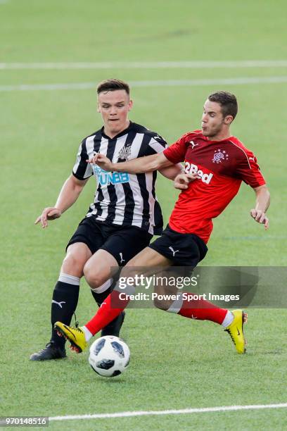 Owen Bailey of Newcastle United fights for the ball with Liam Burt of Glasgow Rangers during the Main Cup Final match between Newcastle United and...