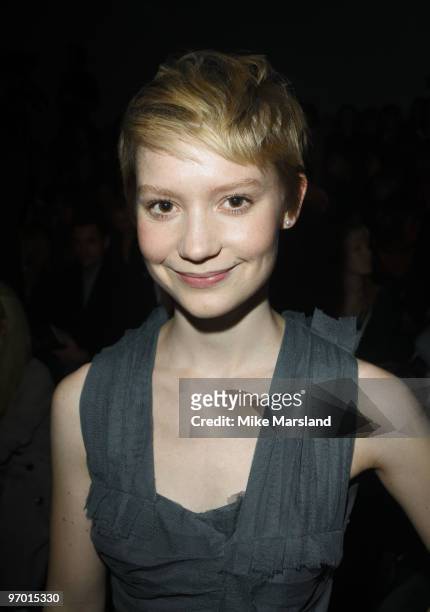 Mia Wasikowska poses on the front row at the Burberry Prorsum show for London Fashion Week Autumn/Winter 2010 at on February 23, 2010 in London,...