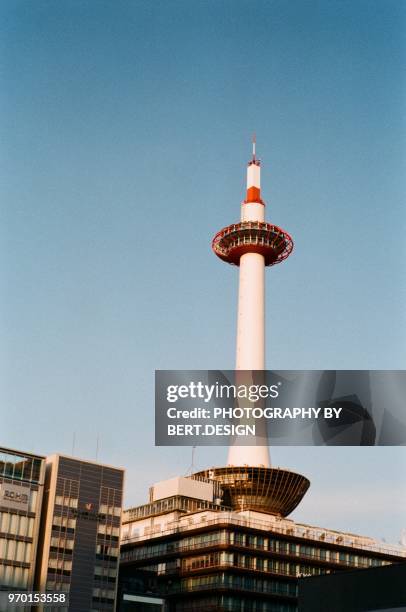 low angle view of kyoto tower against sky - kyoto tower stock pictures, royalty-free photos & images
