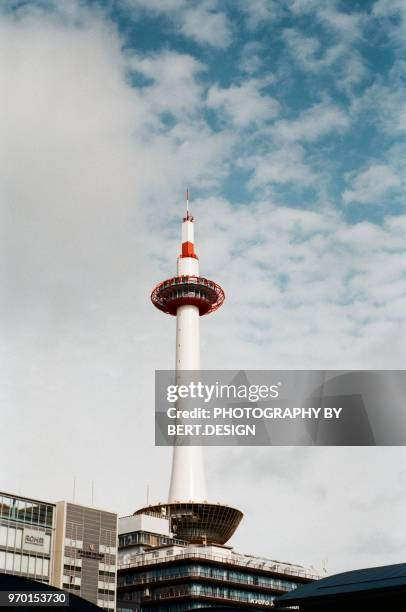 low angle view of kyoto tower against sky - kyoto tower stock pictures, royalty-free photos & images