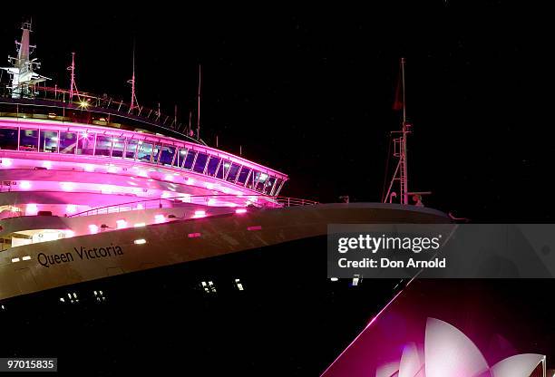 Cunard cruise ship the Queen Victoria is illuminated in pink to raise awareness for breast cancer research in Sydney Harbour on February 19, 2010 in...