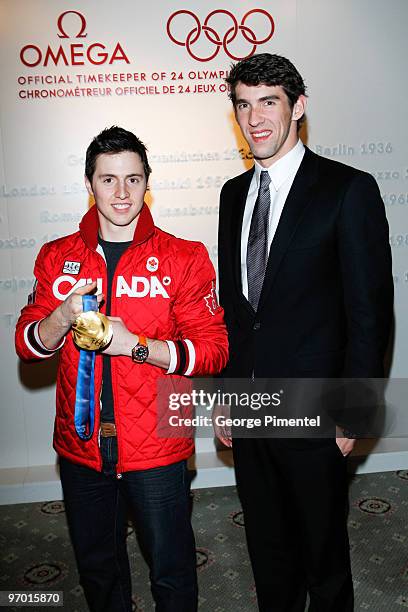 Olympic Gold Medalists Michael Phelps and Alexandre Bilodeau attend the OMEGA Cocktail Celebration at the Fairmont Hotel on February 18, 2010 in...