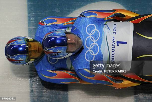 Mark Grimmette and Brian Martin of the US take a corner during the men's doubles luge practise at the Whistler Sliding Centre on February 14, 2010....