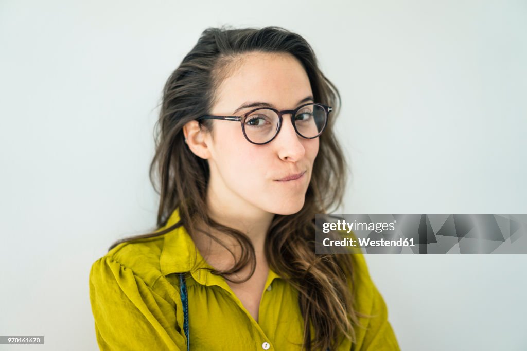 Portrait of young woman wearing glasses