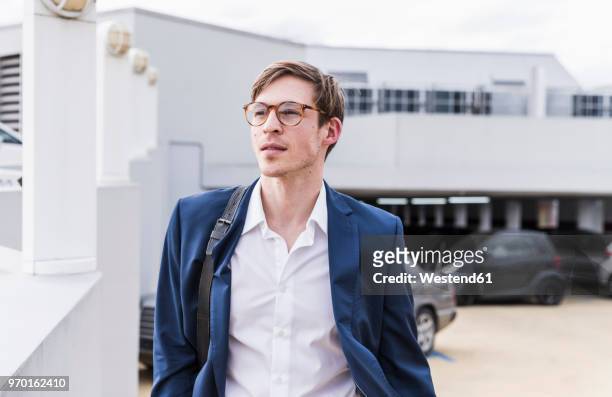 confident businessman at parking garage - man leaving stock pictures, royalty-free photos & images
