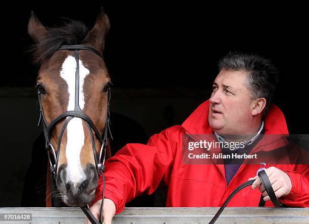 Trainer Paul Nicholls with his Cheltenham Gold Cup winning horse Kaurto Star during an open day at his Manor farm Stables on February 24, 2010 in...