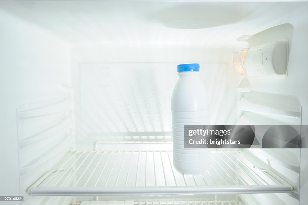 Milk bottle in refrigerator