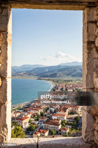 greece, pelopnnes, view on paralia astros through castle window - arcadia greece stock pictures, royalty-free photos & images